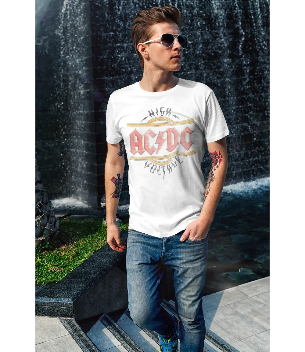 Man wearing Unisex short sleeve white t-shirt featuring official AC/DC vintage style logo in the iconic red and yellow with the text High Voltage  and lightning bolts / Retro Tees