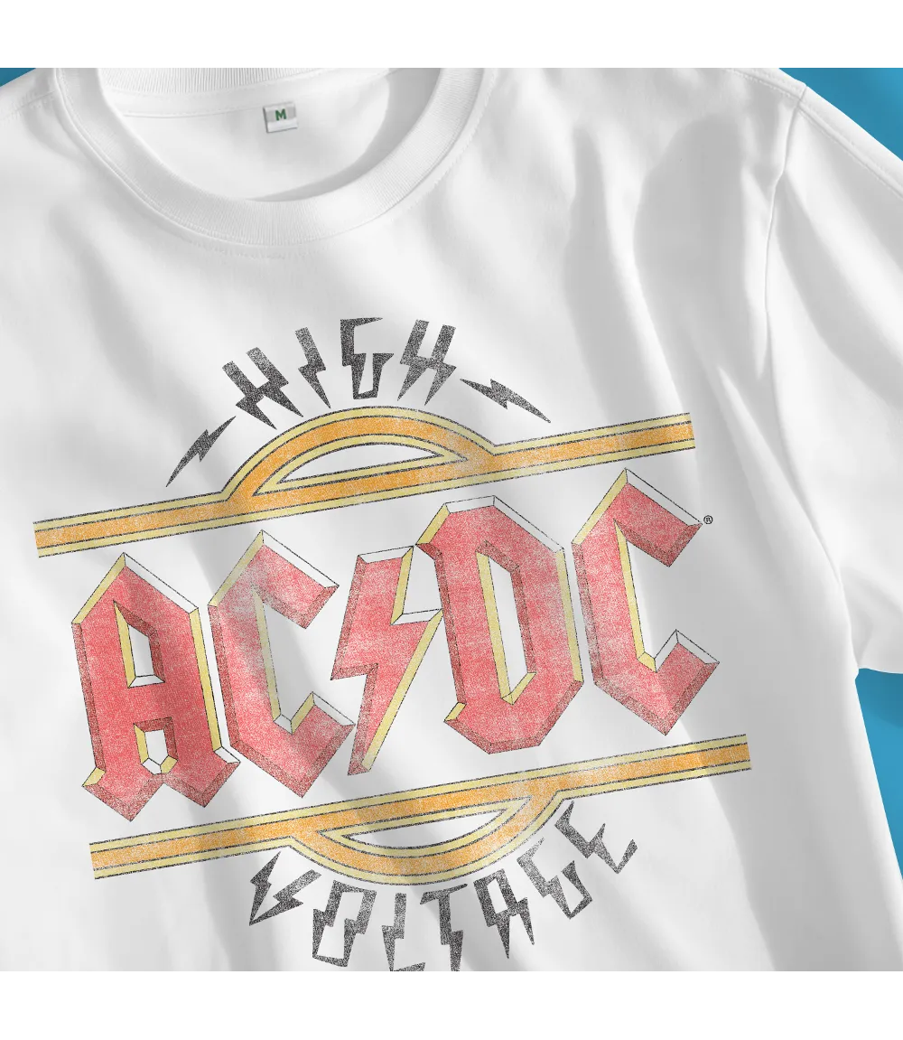 Close up of Unisex short sleeve white t-shirt featuring official AC/DC vintage style logo in the iconic red and yellow with the text High Voltage  and lightning bolts / Retro Tees