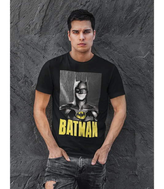 Man wearing Unisex short sleeve black t-shirt featuring official Michael Keaton BATMAN retro poster design / Retro Tees