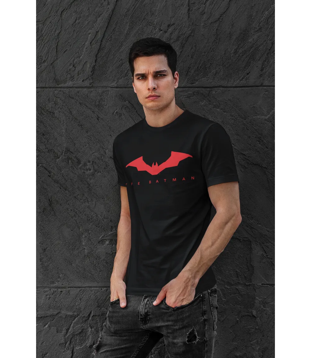 Man wearing Unisex short sleeve black t-shirt featuring official DC Comics The BATMAN text in red and red Bat logo design / Retro Tees