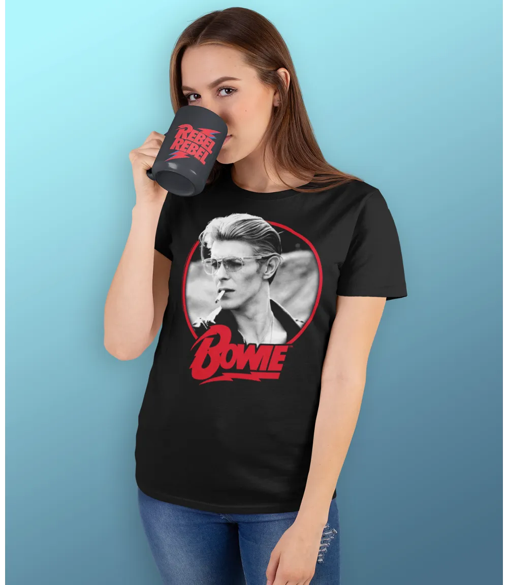 Woman wearing Unisex short sleeve black t-shirt featuring official David Bowie smoking portrait design with Bowie text in red below / Retro Tees