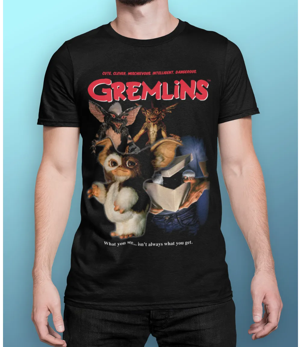 Man wearing Unisex short sleeve black t-shirt featuring official Gremlins 80s movie poster design with beloved characters, Gizmo and Stripe / Retro Tees