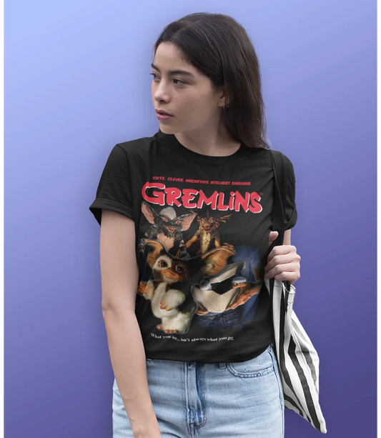 Woman wearing Unisex short sleeve black t-shirt featuring official Gremlins 80s movie poster design with beloved characters, Gizmo and Stripe / Retro Tees