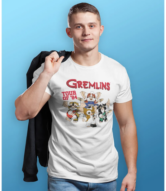 Man wearing Unisex short sleeve white t-shirt featuring official Warner Bros Gremlins Tour Of 84 - The Mogwais Rock Band design / Retro Tees