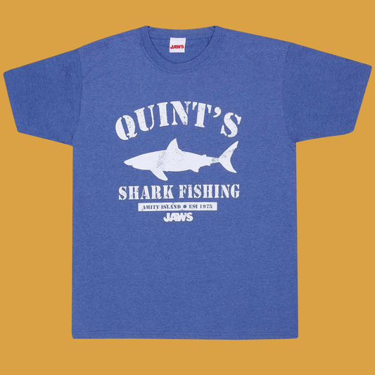 Heather blue crew neck short sleeve t-shirt featuring poster style print from the epic Jaws movie featuring great white shark and text, Quint's Shark Fishing Amity Island 1975 and JAWS logo all in white 