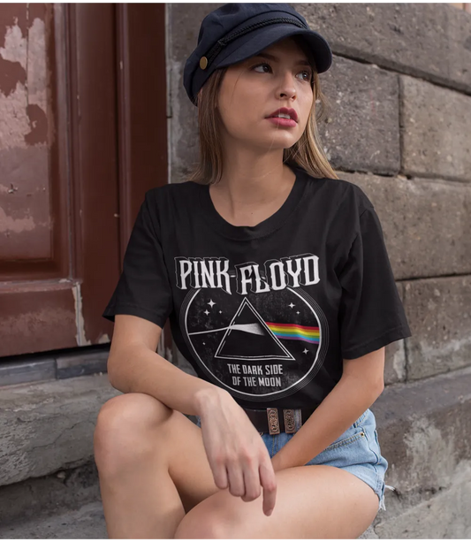 Woman wearing Unisex short sleeve black t-shirt featuring official Pink Floyd, Dark Side Of The Moon album cover design / Retro Tees