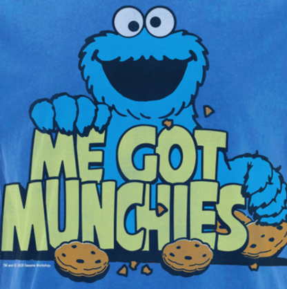 Exclusive Famous Forever vintage washed blue short sleeve crew neck t-shirt featuring retro Sesame Street Cookie Monster design with Me Got Munchies text. Full colour design with a vintage style. Officially Licenced