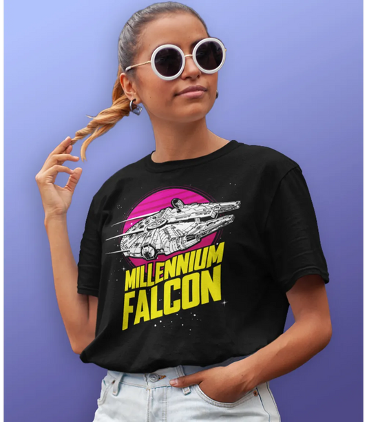 Woman wearing Unisex short sleeve black t-shirt featuring official Star Wars movie Millennium Falcon in flight in Black and white on a pink/red circle planet design with Millennium Falcon text in yellow below / Retro Tees