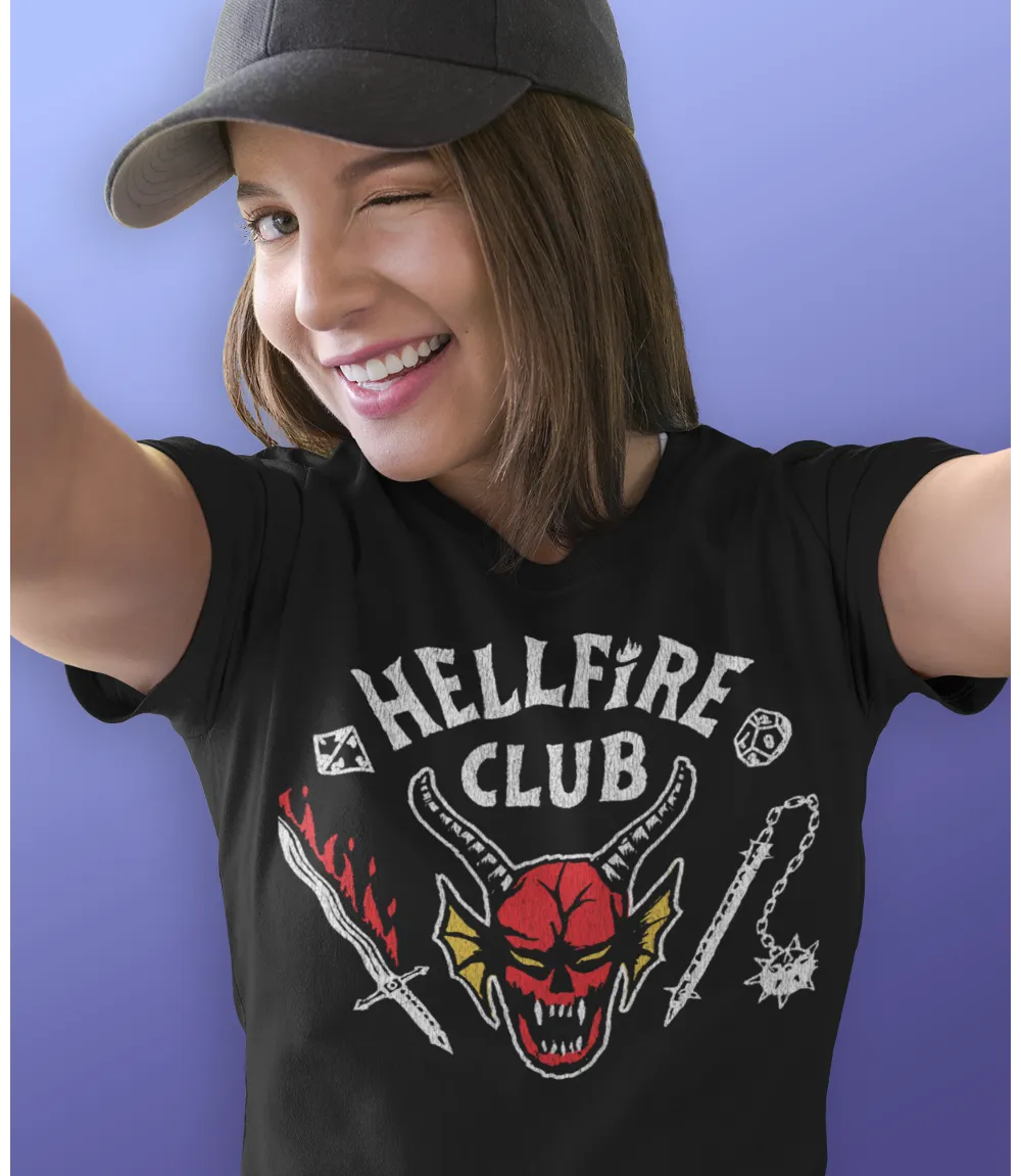 Woman wearing Unisex short sleeve black t-shirt featuring official Stranger Things Hellfire Club Logo Design / Retro Tees