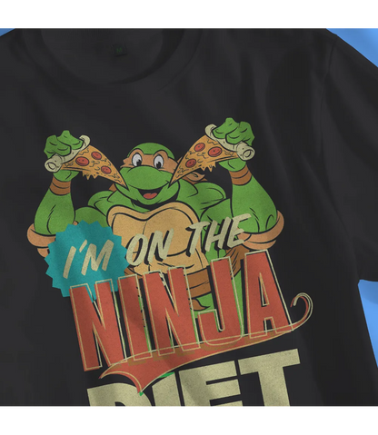 Unisex short sleeve black t-shirt featuring official Teenage Mutant Ninja Turtles Michelangelo with pizza design with I'm on the Ninja Diet text / Retro Tees
