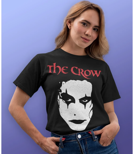 Woman wearing Unisex short sleeve black t-shirt featuring official 90s movie The Crow Brandon Lee Face design / Retro Tees